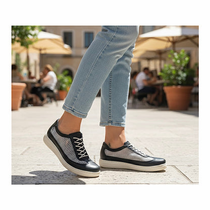 Cloud shoes in black leather and transparent mesh.