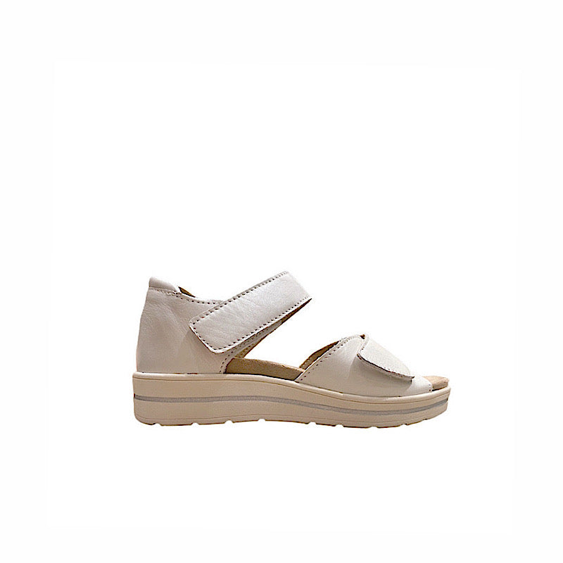 White leather comfort sandals with Velcro straps.